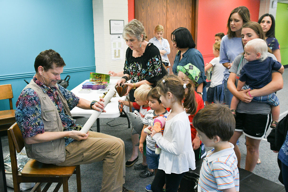 Singing zoologist Lucas Miller visits Bryan library